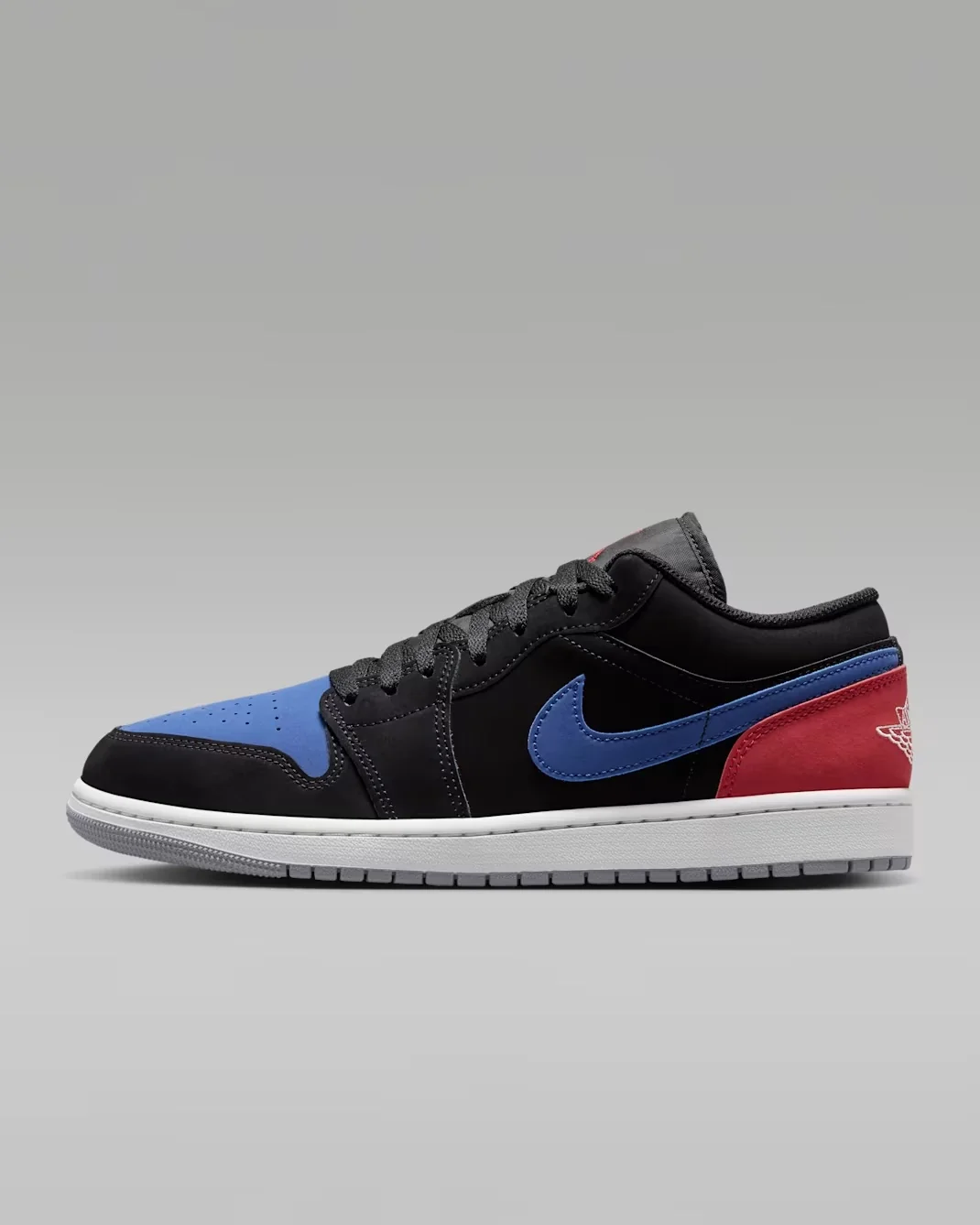 Air Jordan 1 Low Black True Blue Varsity Red Summit White sneaker side profile with blue Swoosh and red heel overlay.