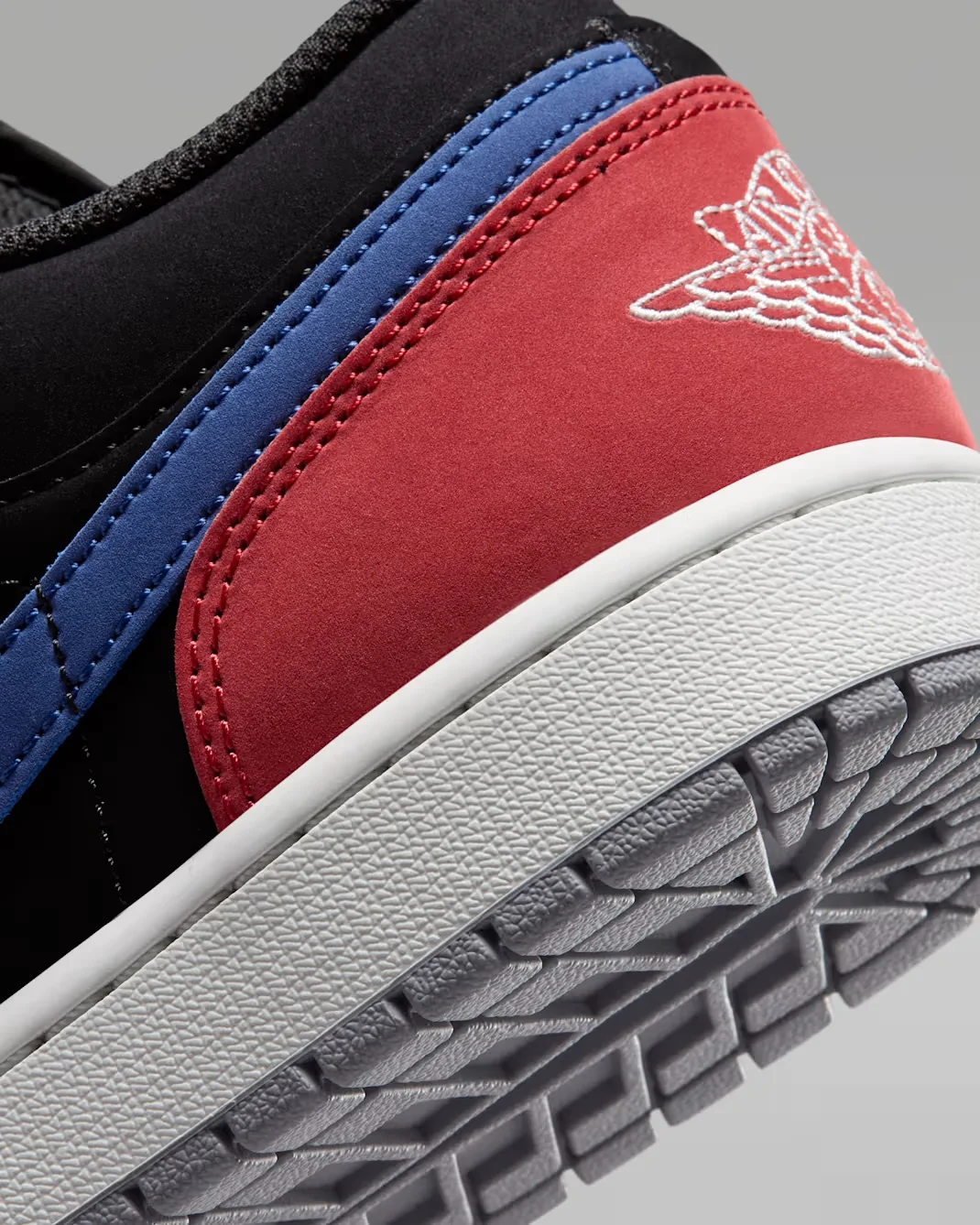 Close-up of the Varsity Red heel overlay and Wings logo on the Air Jordan 1 Low.