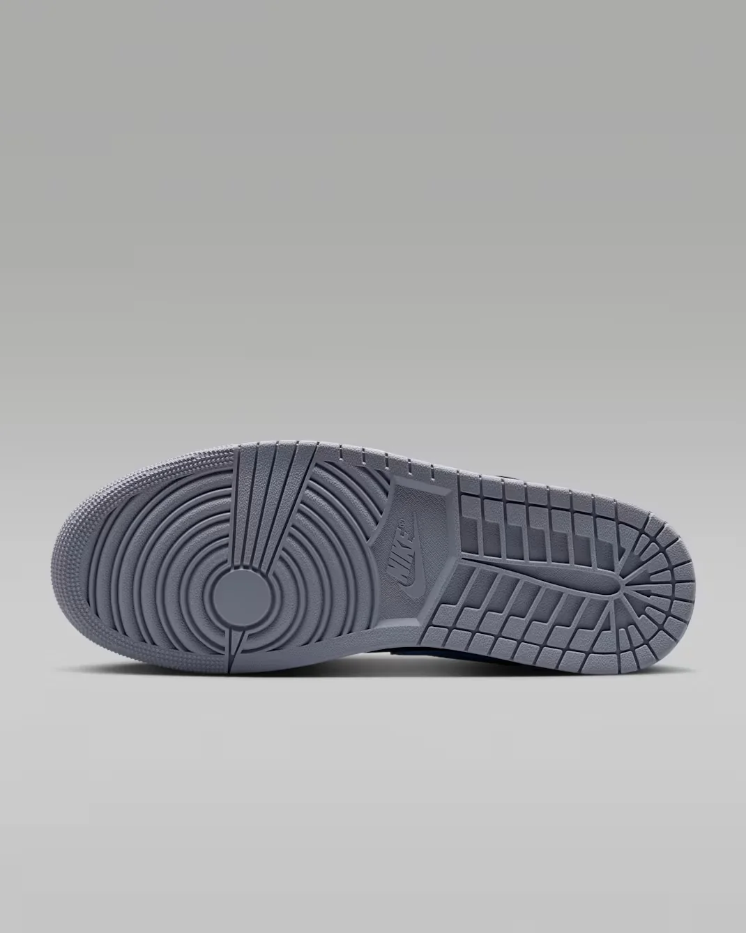 Air Jordan 1 Low Black True Blue Varsity Red Summit White grey rubber outsole traction pattern.