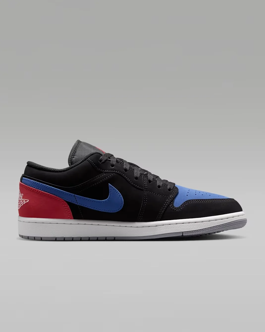 Side profile of the Air Jordan 1 Low Black True Blue Varsity Red Summit White showing blue Swoosh and red heel.
